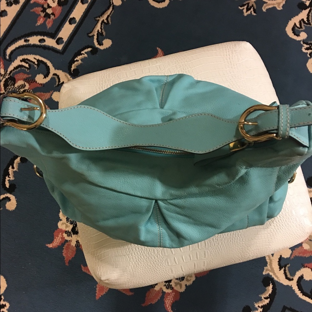 Genuine Leather Avida Turquoise shoulder bag.